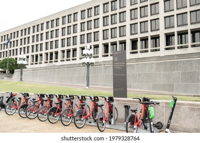 Washington, District Of Columbia US - May 24, 2021: Line Of Unrented Capital Bikeshare Bicycles Parked In Front Of US Department Of Labor Headquarters Building With No Customers Due To Telework