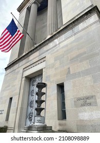 WASHINGTON - JANUARY 17, 2022: US DEPARTMENT OF JUSTICE Sign And Flag At Building Entrance Located In Washington DC.