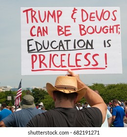 WASHINGTON JULY 22: A Demonstrator Holds A Sign At The March For Education To Show Support For Public Education And The Need For Federal Funds In Washington DC On July 22, 2017 

