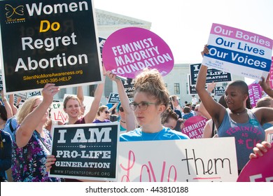 WASHINGTON JUNE 27:  Pro-life and pro-choice activists await the Supreme Courtâ??s ruling on abortion access in front of the Supreme Court in Washington, DC on June 27, 2016
