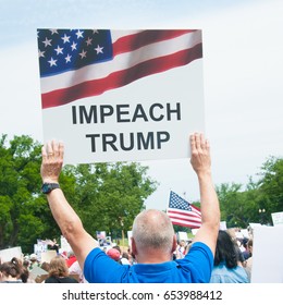 WASHINGTON – JUNE 3: A protester holds at sign at the March for Truth in Washington, DC on June 3, 2017 