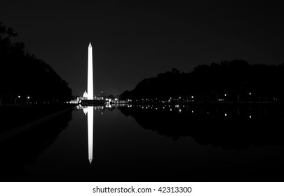 The Washington Monument in Washington DC in black and white at night.