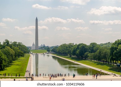 The Washington Monument Mirrored By The Waters Of The Reflecting Pool