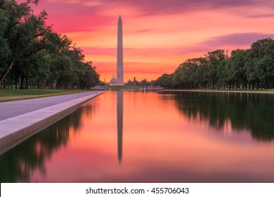 Washington Monument On The Reflecting Pool In Washington, DC At Dawn.