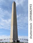 Washington Monument on a sunny day with clouds