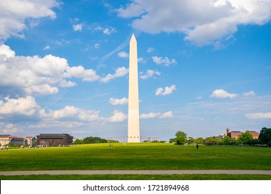 Washington Monument On Sunny Day With Blue Sky Background.