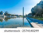 Washington Monument seen from the World War II memorial Pool. National Mall, Washington DC, USA