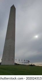 The Washington Monument, Washing Dc With Sun Hidden Behind Cloudy Sky