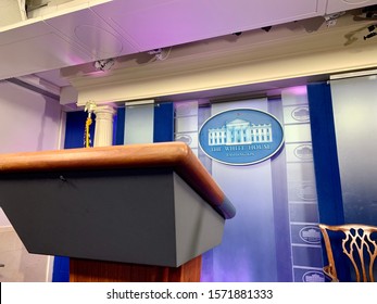 WASHINGTON - NOVEMBER 26, 2019: View Of The THE WHITE HOUSE Sign And Podium Located In The James S. Brady Press Briefing Room Of The West Wing