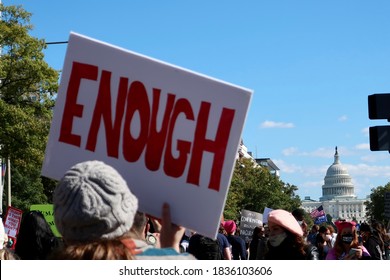 WASHINGTON - OCTOBER 17, 2020: WOMEN’S MARCH View With US CAPITOL BUILDING - Blurred ENOUGH Protest Sign