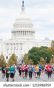 WASHINGTON OCTOBER 28: Runners compete in the Marine Corps Marathon on October 28, 2018 in Washington DC