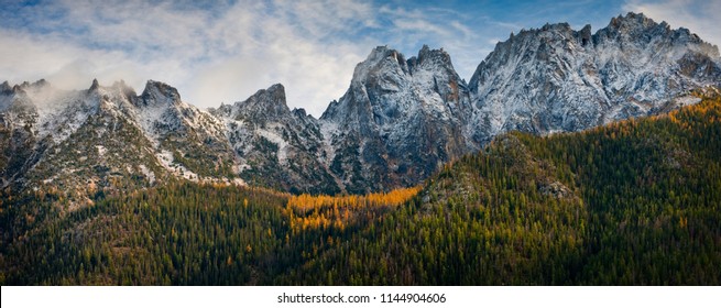 Washington Pass Along the North Cascades Highway During the Autumn Season. Larch trees and snow on the hills signal the approach of winter in the North Cascade Mountain range.