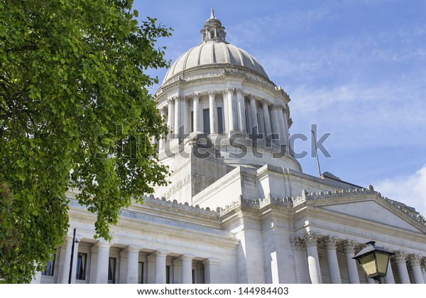 Washington State Capitol Building in Olympia\
Framed by Tree\
Foliage