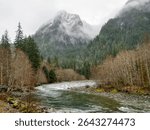Washington State, Central Cascades. Mount Baker Snoqualmie National Forest, Mount Garfield with snow and clouds and the Middle Fork Snoqualmie River