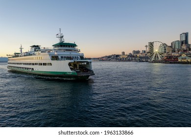 A Washington State Ferry Approaches Downtown Seattle After Sailing Across The Puget Sound In The Middle Of A Pacific Northwest Summer