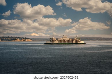 A WASHINGTON STATE FERRY ON PUGET SOUND BETWEEN MUKILETO AND WHIDBEY ISLAND WITH A NICE SKY AND MOUNT BAKER IN THE BACKGROUND - Powered by Shutterstock