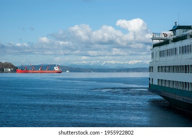 Washington State Ferry Suquamish docked at Colman Dock, Seattle, with Olympic Mountains in the backdrop