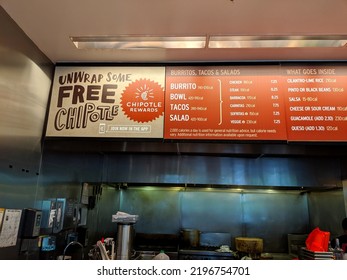 Washington, United States - May 18, 2019: Chipotle Mexican Grill Menu On Wall In Kitchen Featuring Burrito, Bowl, Tacos, Salad, Chicken, Steak, Barbacoa, Carnitas, Sofritas, Veggies, Salsa, Guacamole.