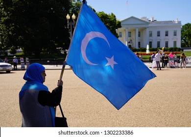 Washington/USA – July 18, 2018: A Uyghur Demonstrator At The White House Calling For China To End Its Oppression Of The Ethnic Minority.