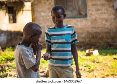 Wasini, Kenya »; August 2018: Two Young People Share A Chocolate Bar In A Village Of Wasini