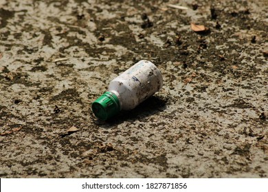 Waste bottle on the soil