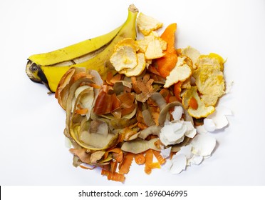 Waste From The Food Industries The Carrots, Banana, Potatoes, Orange, Onion, Egg Shell On A White Background. Flat Lay. Top View. Waste For Recycling. 