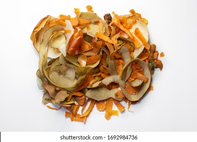 Waste From The Food Industries The Carrots, Potatoes, Onion, Egg Shell On A White Background. Flat Lay. Top View. Waste For Recycling. 