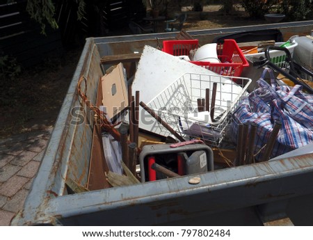 waste inside a dumpster skip