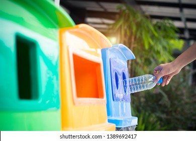 Waste management, Woman throwing plastic bottle into recycle bin. Waste separation rubbish before drop to garbage bin to save the world, environment care. Pollution trash recycling management concept. - Shutterstock ID 1389692417