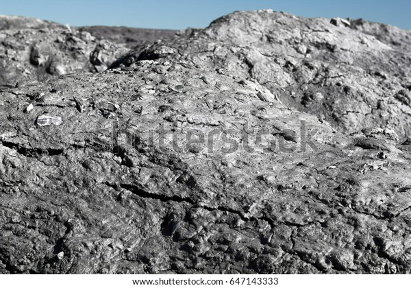 waste of the processing\
of oil shale - shale sand shot close up and looks like on the\
surface of the moon.