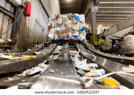 A waste sorting facility, also known as a Materials Recovery Facility (MRF) or recycling center, is a specialized plant that receives and separates mixed waste to isolate recyclable materials.