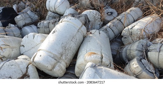 Waste styrofoam buoys are piled up in disorder.