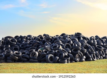 Waste tires and tyres at landfill for recycling. Regenerated tire rubber produced. Reuse of the waste rubber tyres. Pile of old wheels for recycling. Disposal of waste tires. Tyre dump