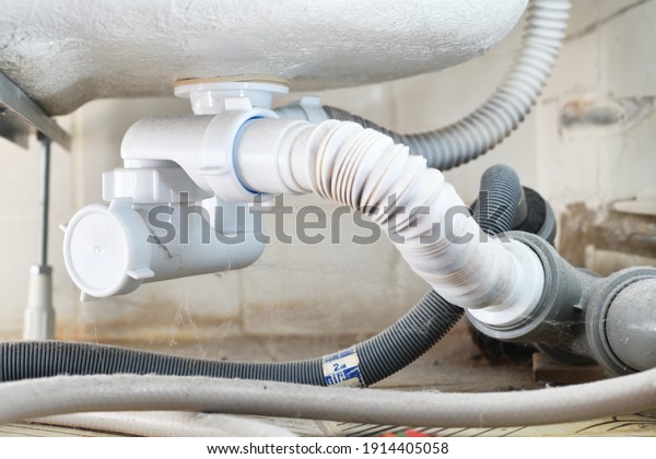 Waste water siphon or sink drain\
connected to the bottom of the acrylic tub. Installation, cleaning\
and repair of household plumbing and PVC plastic sewer\
pipes.
