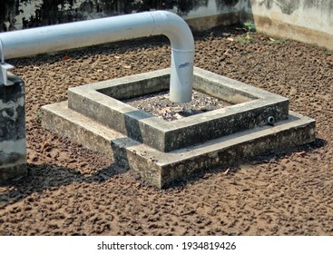 The waste water treatment technology and management system show the metal pipe for flowing smelly liquid sludge to a well for drying, use as a fertilizer in agriculture field and Industrial concept.