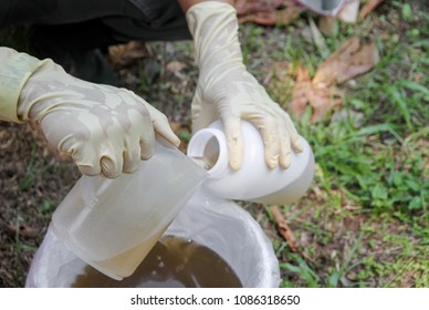 Wastewater Sampling By Method Composite Sampling. ( Pouring Water Put Bottles )