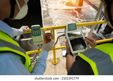 Wastewater treatment concept. Service engineer on  waste water Treatment plant and checking oxygen in water with tablet.  Wastewater treatment concept. Service engineer on waste water Treatment plant. - Shutterstock ID 2101391779