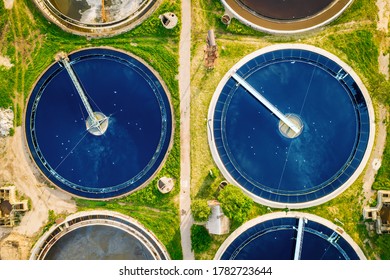 Wastewater treatment plant, round pools for filtration of dirty or sewage water, aerial top view.