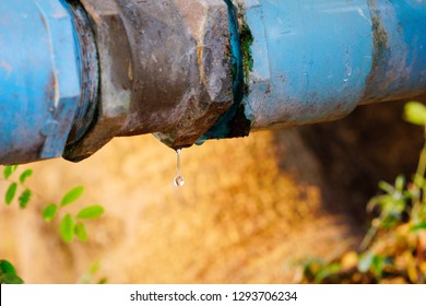 Wasting water - water drop from water 
pipe.
