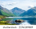Wastwater is the deepest lake in England. Scafell Pike, the tallest mountain, can be seen in the distance.