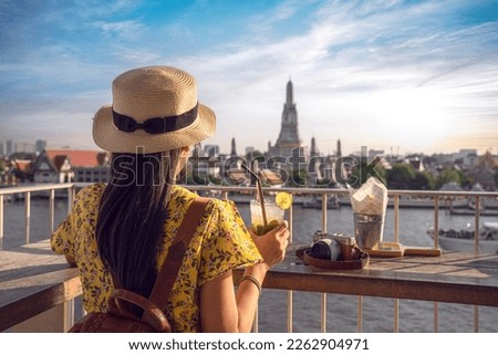 Wat arun pagoda with sunset background in Bangkok city of Thailand, Take a picture from a roof top of hotel near the chao phraya river, The best travel destination for travel in Bangkok and Thailand
