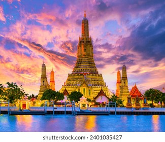 Wat Arun temple Bangkok during sunset in Thailand. Chao praya river Bangkok at dusk evening light with a colorful sky and light on the temple - Powered by Shutterstock