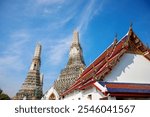 Wat Arun, or the Temple of the Dawn, is a renowned Bangkok landmark famous for its iconic prang, a tall spire dating back to before 1656 CE. Located along the Chao Phraya River, this temple showcases 