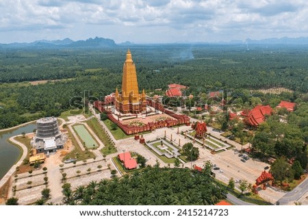 Wat Bang Thong, Krabi, Southern Temple. The pagoda is a buddhist temple in urban city town, Thailand. Thai architecture landscape background. Tourist attraction landmark.