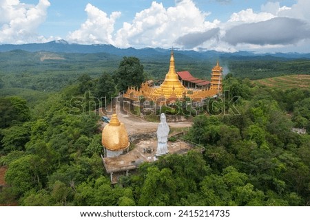 Wat Bang Thong, Krabi, Southern Temple. The pagoda is a buddhist temple in urban city town, Thailand. Thai architecture landscape background. Tourist attraction landmark.