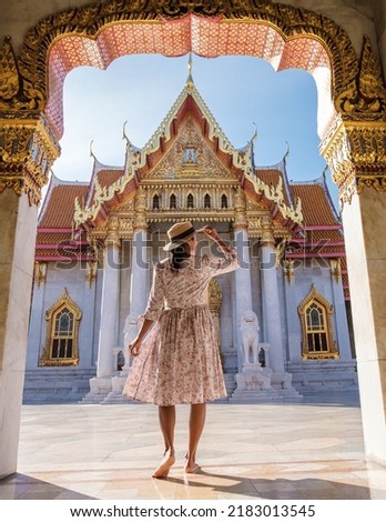 Wat Benchamabophit temple in Bangkok Thailand, The Marble temple in Bangkok. Asian woman with hat visiting temple in Bangkok
