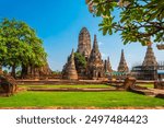 Wat Chaiwatthanaram in The Ayutthaya Historical Park is landmark and popular place for tourists to come and visit wearing traditional Thai costumes.