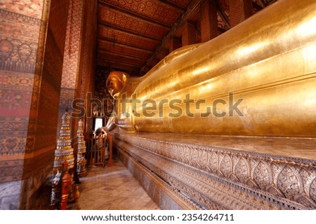 Wat Pho temple. Big Reclining golden Buddha statue (Phra Buddhasaiyas).  Bangkok. Thailand.