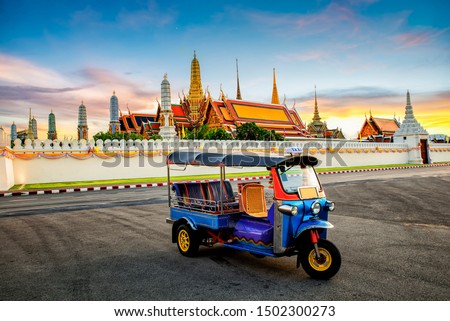 Wat Phra Kaew in Bangkok, Thailand and Tuk Tuk is on the road : Grand Palace and Wat Phra Kaew is among the best known of Thailand's landmarks