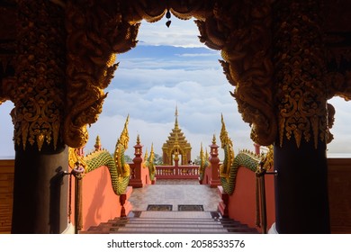 Wat Phra That Doi Phra Chan on the top hill of Doi Phra Chan mountain view from within Wihan door. This Buddhist temple is Lanna style architecture in Mae Tha, Lampang, Thailand.